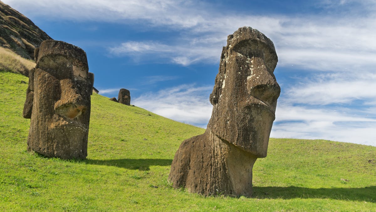 Moai statues on Easter Island under clear blue skies