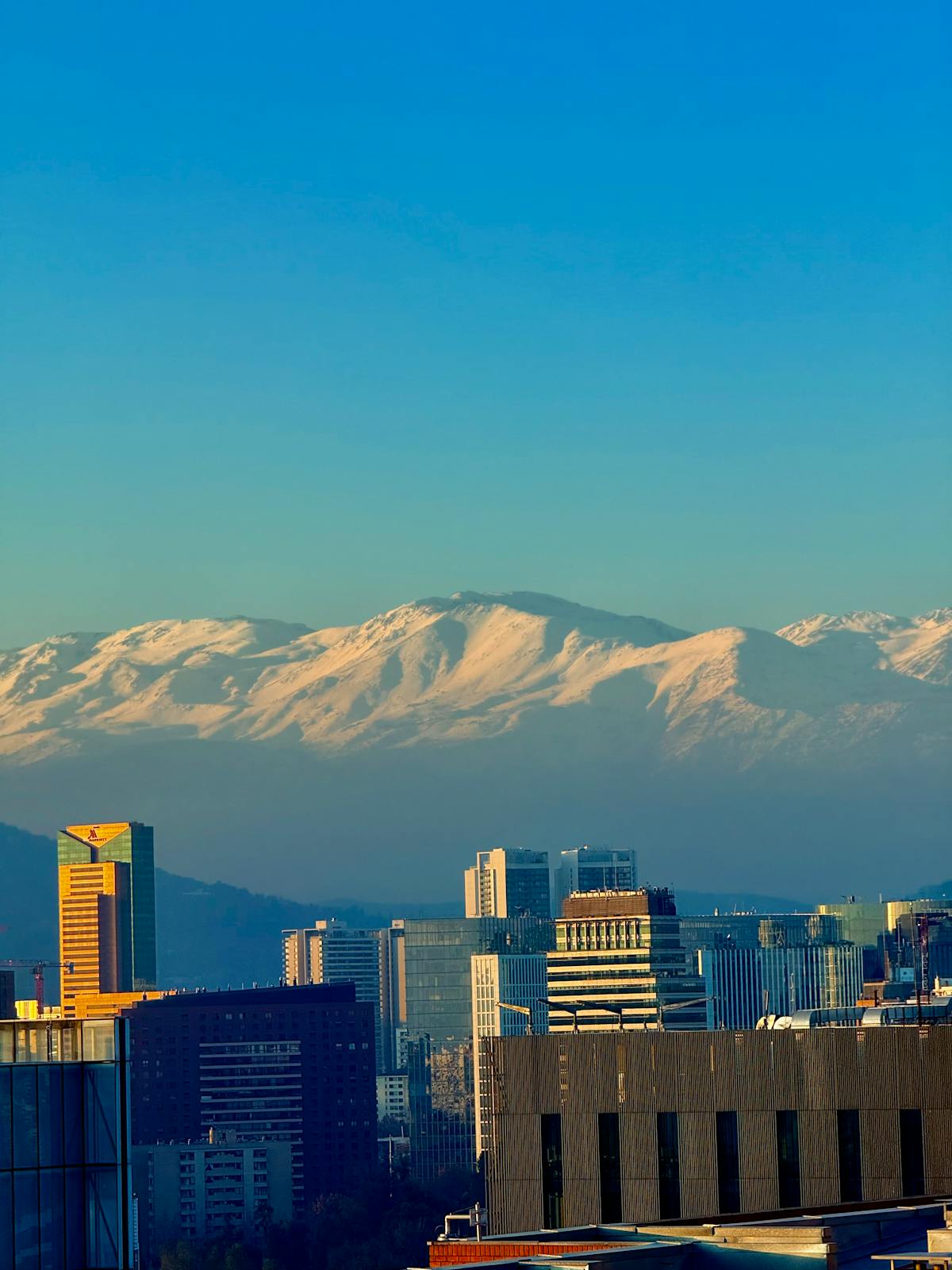 Santiago skyline with snow-capped Andes mountains towering in the background
