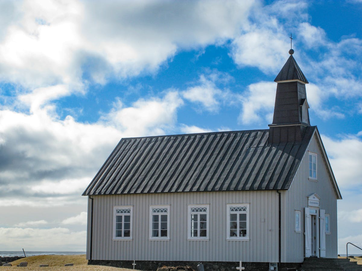 Detailed view of a wooden church showing ornate timber construction and steeple