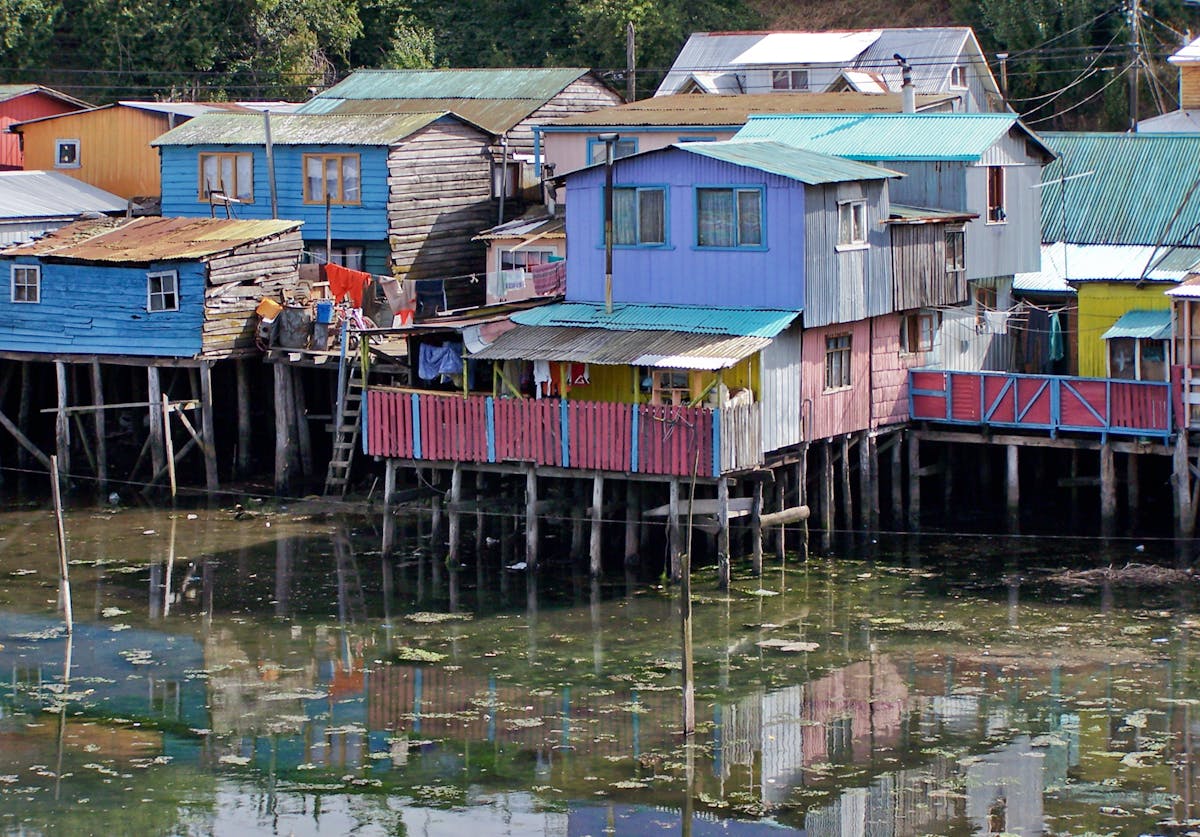 Colourful wooden stilt houses on the waterfront in Castro, Chiloe, Chile