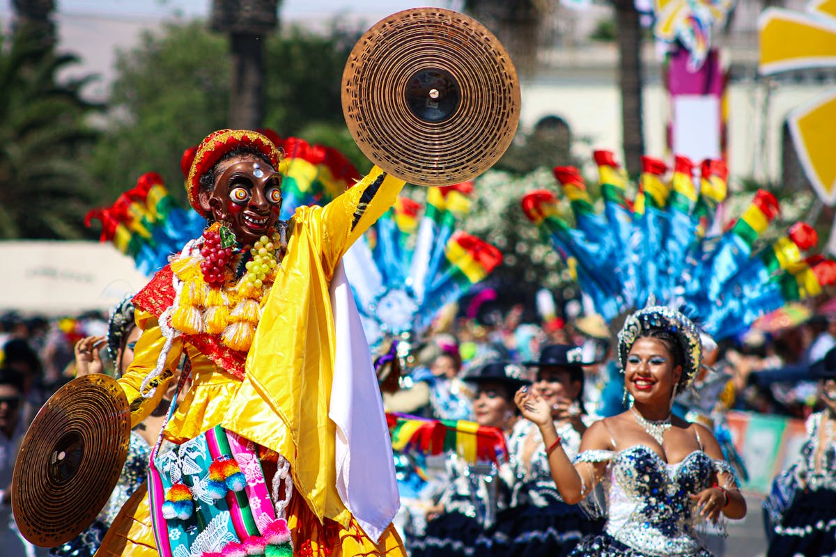 Colorful carnival dancers in traditional costumes at a Chilean festival celebration