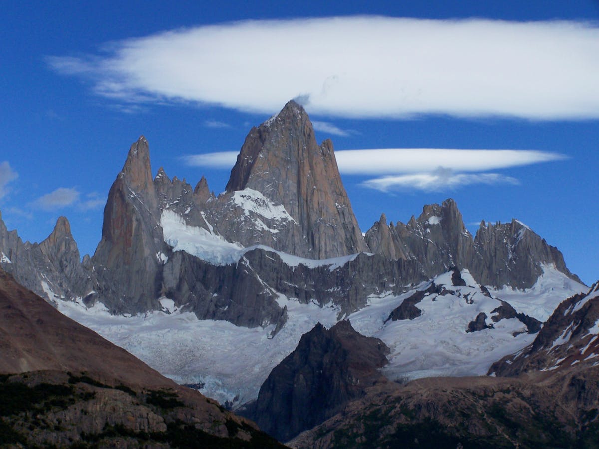 Snow-covered Fitz Roy peak under a clear blue Patagonian sky