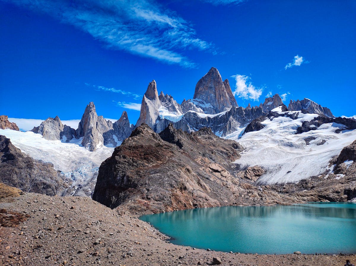 Laguna de los Tres with the jagged granite spires of Fitz Roy rising directly behind the turquoise lake
