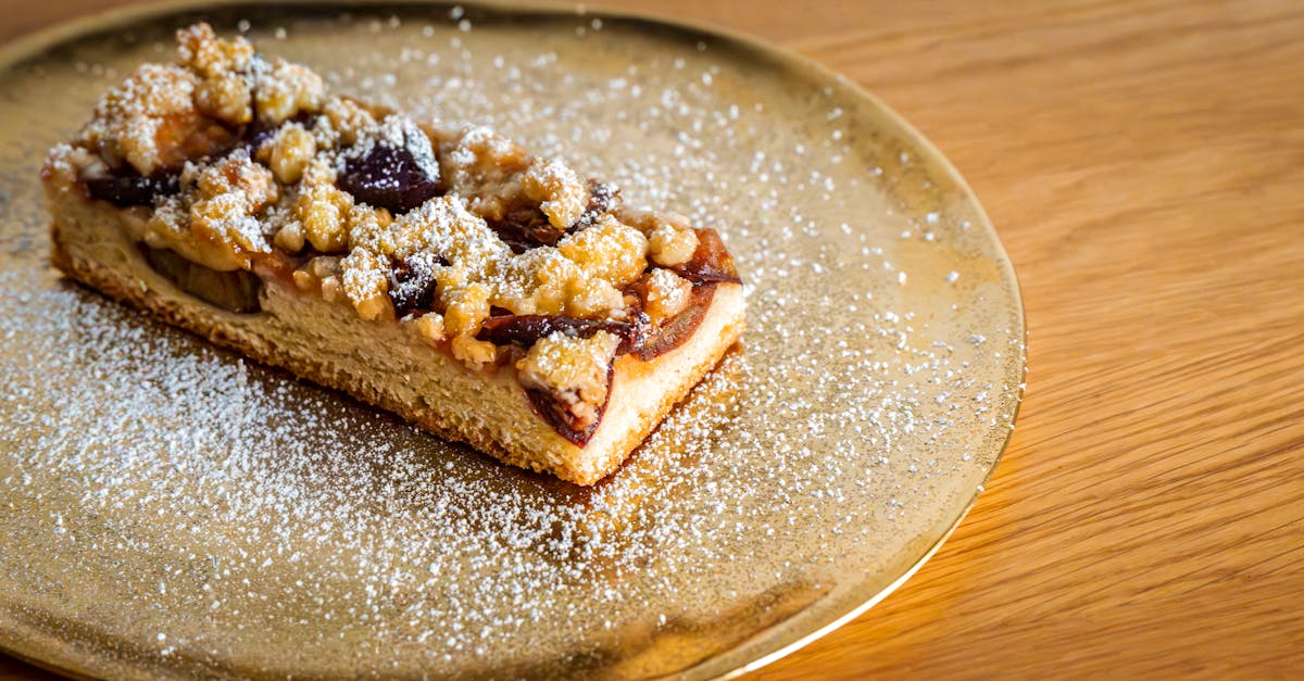 Freshly baked streusel cake with fruity topping and powdered sugar dusting
