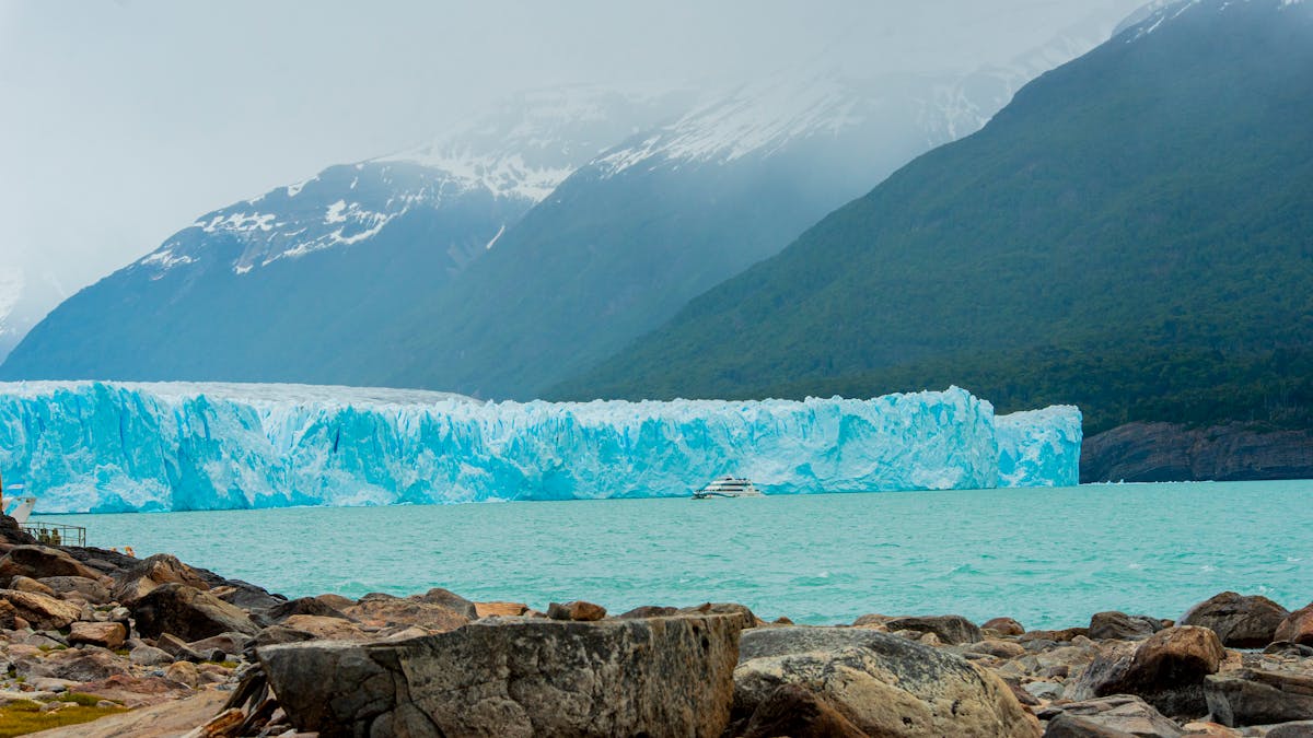 Perito Moreno Glacier with snow-capped mountains and turquoise water in Patagonia Argentina