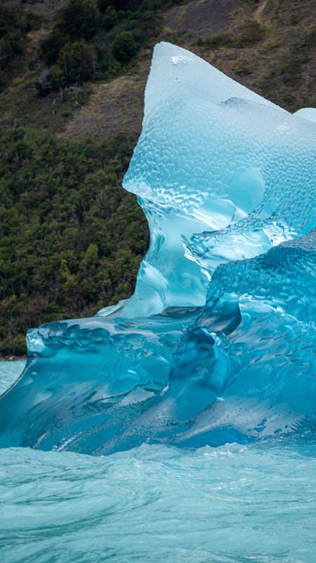 Vivid blue iceberg floating in the waters of Patagonia