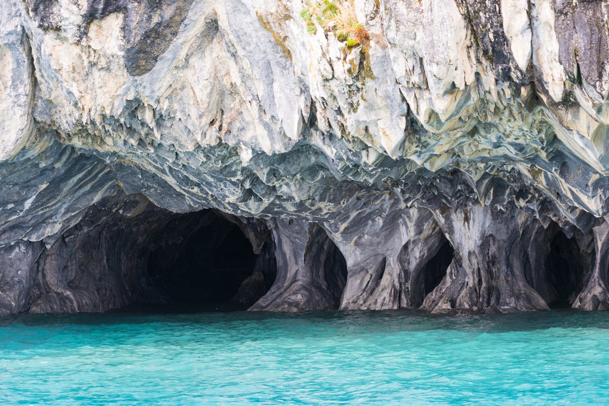 Swirling marble cave formations over turquoise water in Chilean Patagonia