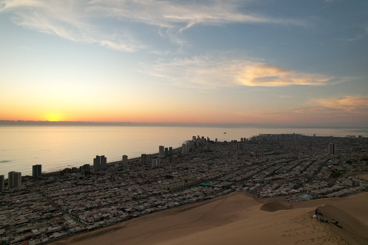 Aerial view of Iquique's coastline with cliffs and Pacific Ocean