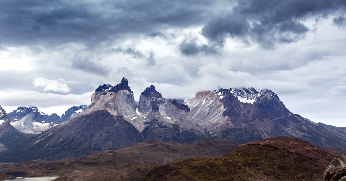 Dramatic mountain landscape in Torres del Paine National Park with moody skies over the Andes