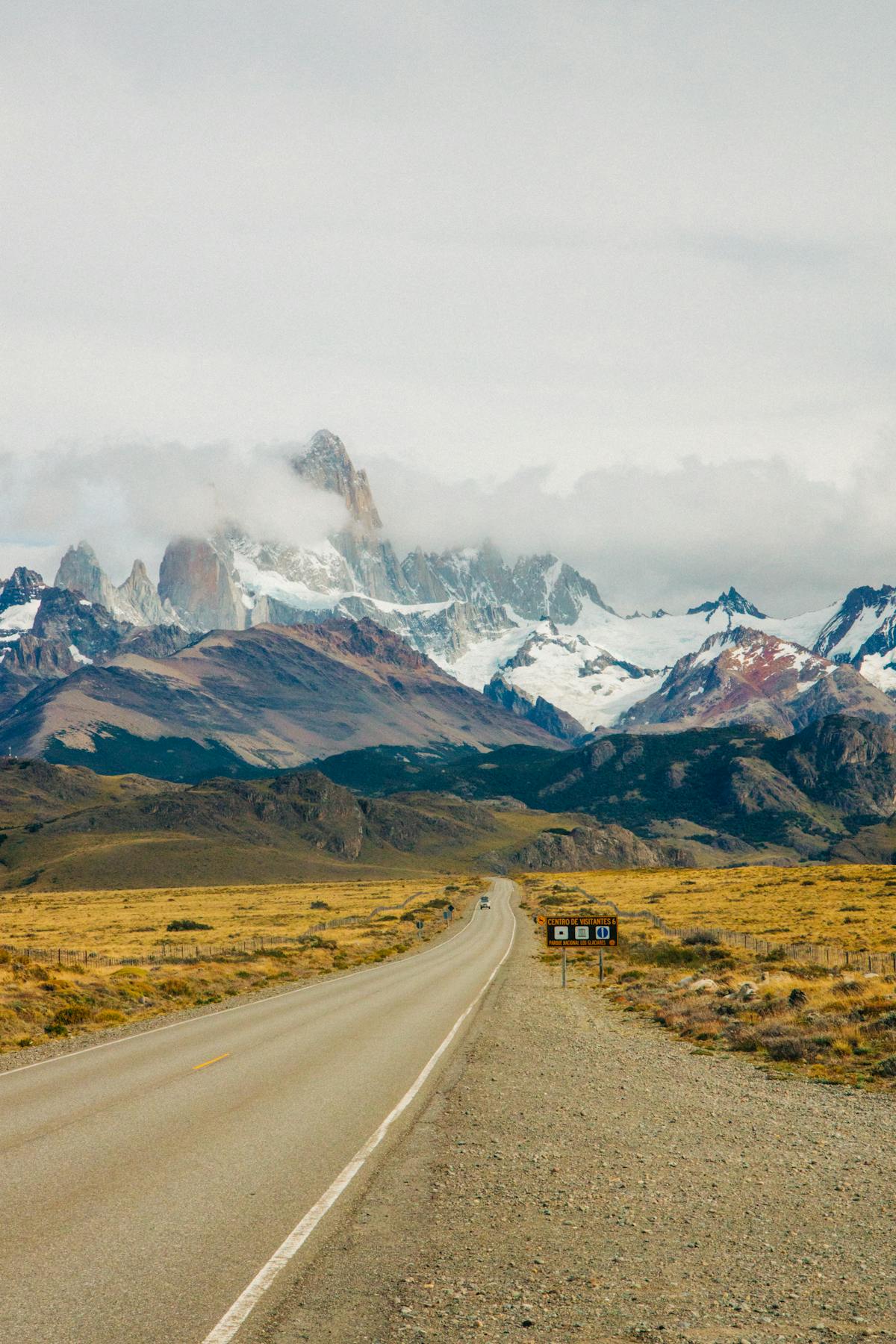 Dramatic view of Mount Fitz Roy along a straight road in El Chalten Argentina