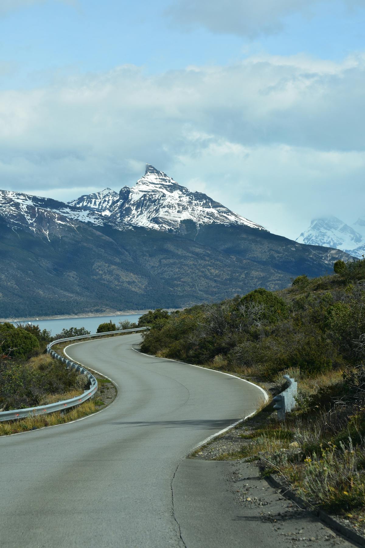 Winding road leading to snowcapped mountains in Patagonia Argentina