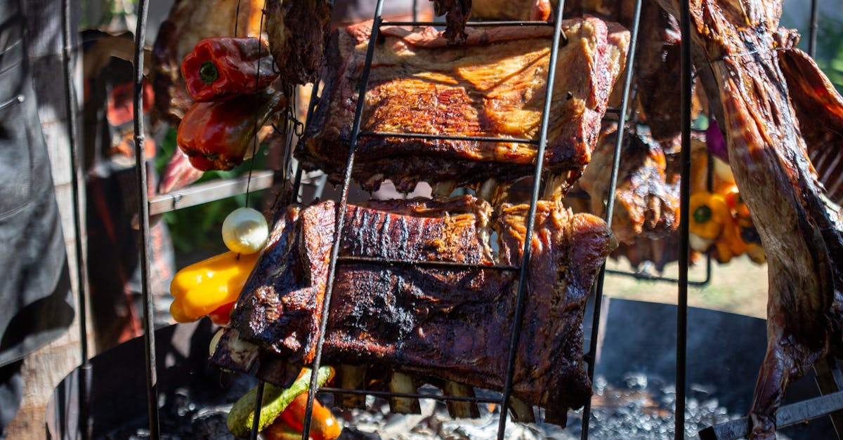 Lamb roasting on an open fire grill in traditional Patagonian style