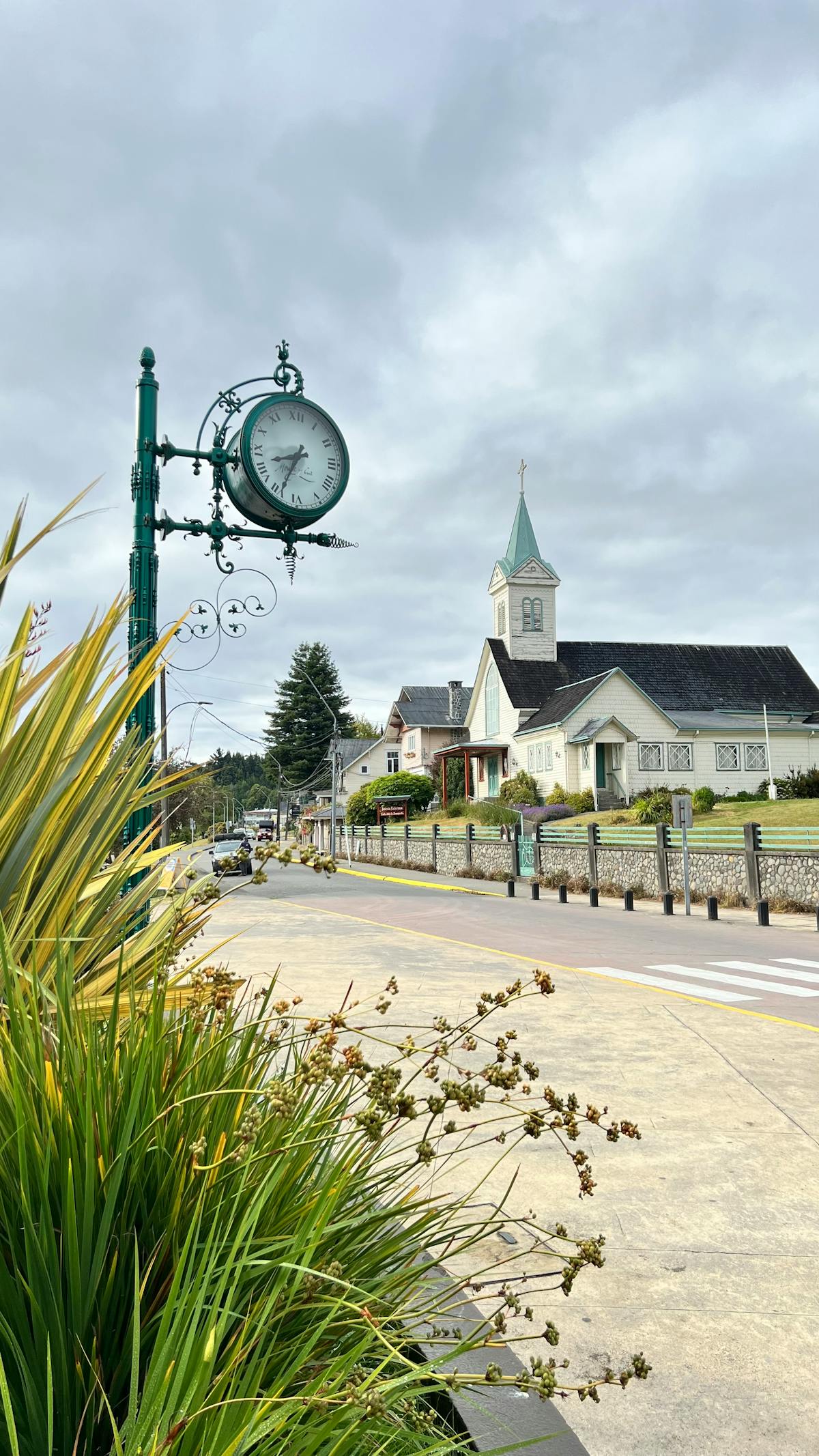 Charming street view with a clock tower and church in Frutillar, Chile