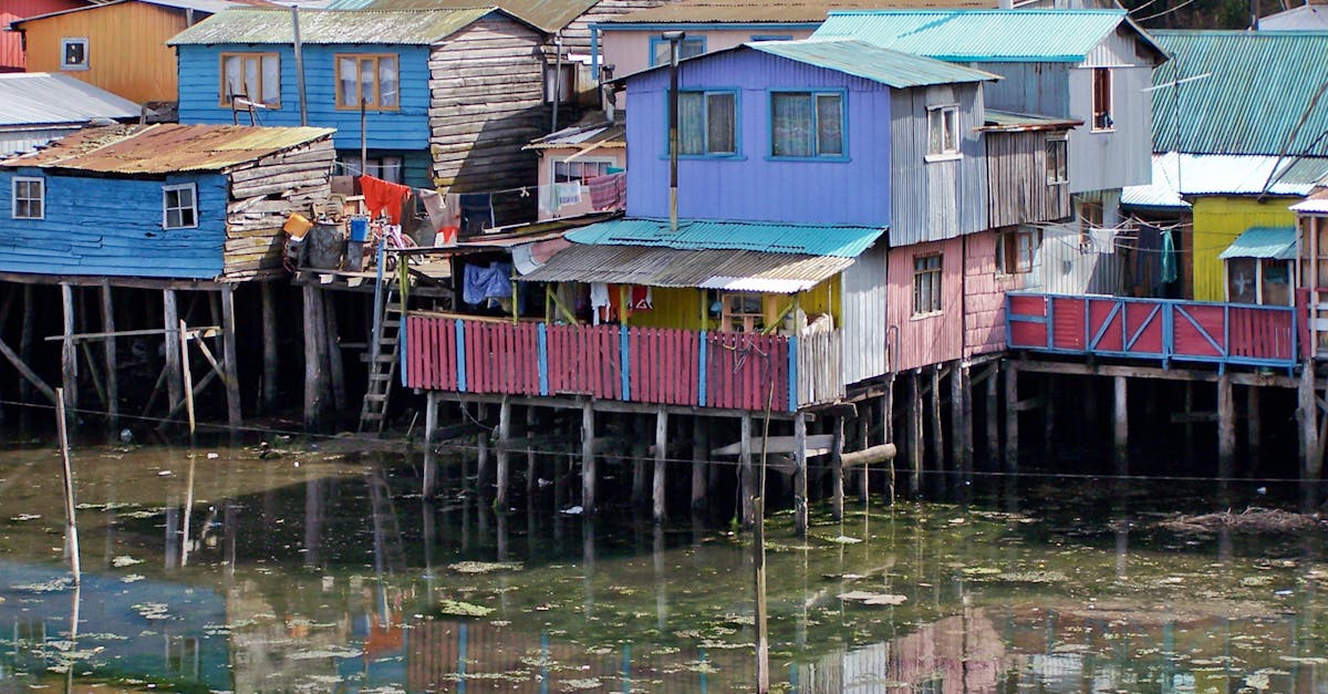 Colorful wooden houses along a river in Chiloe, Chile