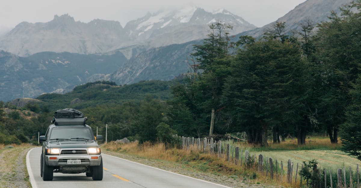 Car driving on a Chilean highway with mountains in the distance