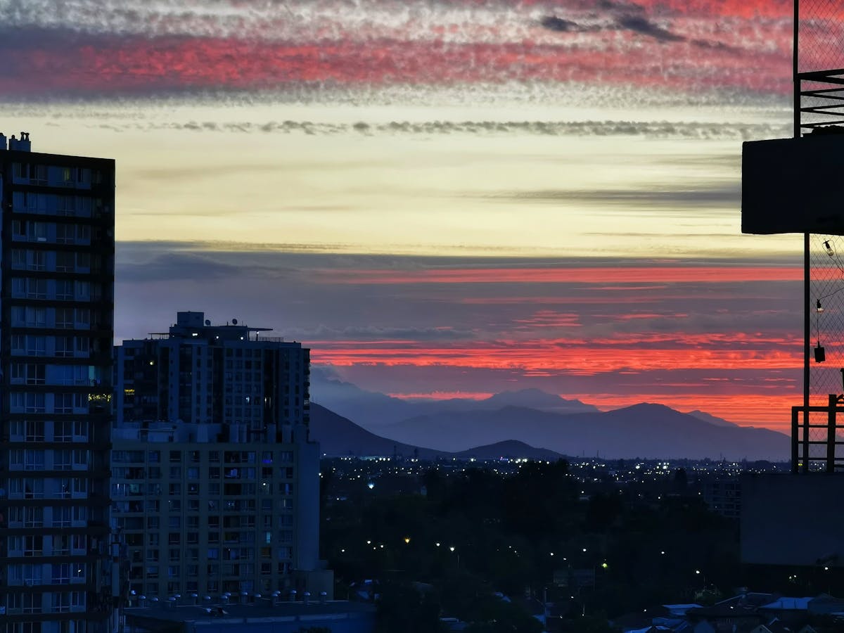 Sunset over Santiago skyline with the Andes mountains glowing in the background