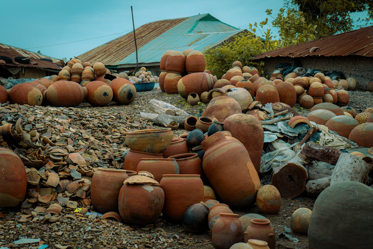 Collection of handmade clay pots and pottery in a traditional village workshop