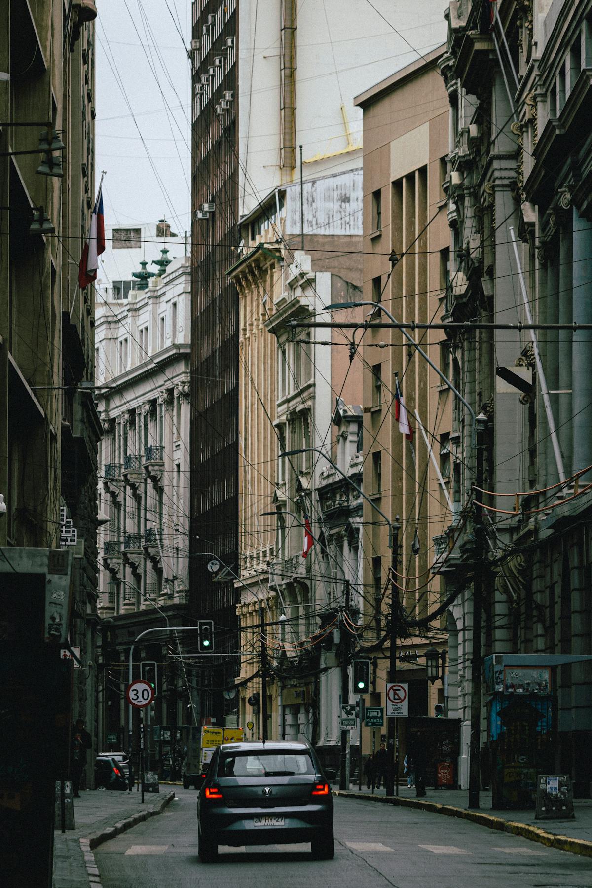 Historic building on a Santiago street with classic architecture and pedestrians