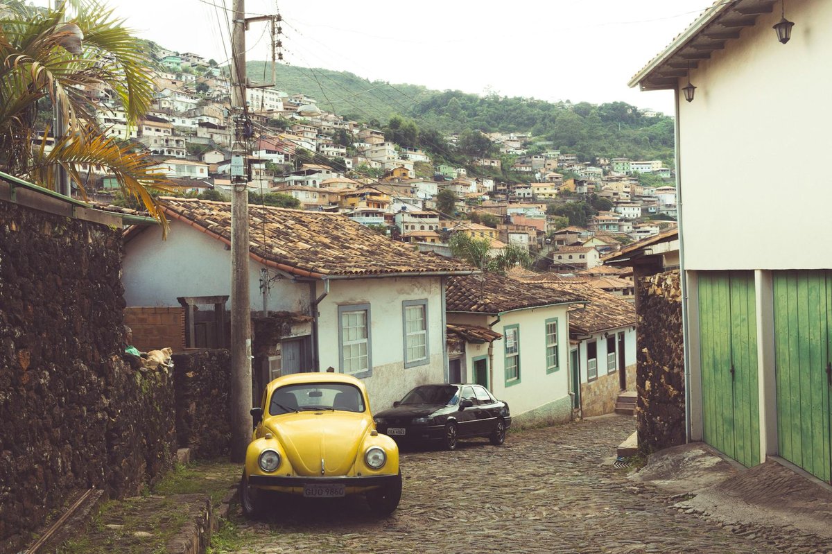 Cobblestone street with colonial-style buildings and facades in a South American neighborhood