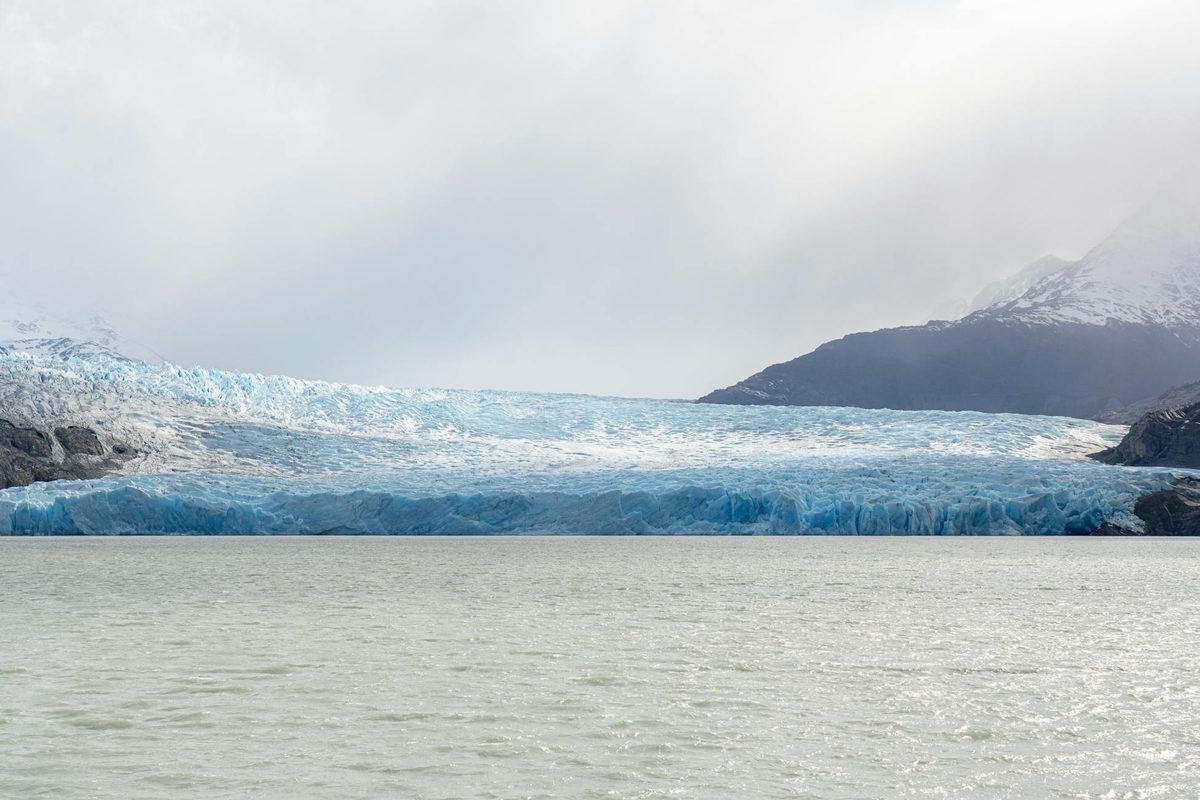 Grey Glacier with mountains and turquoise lake in Torres del Paine