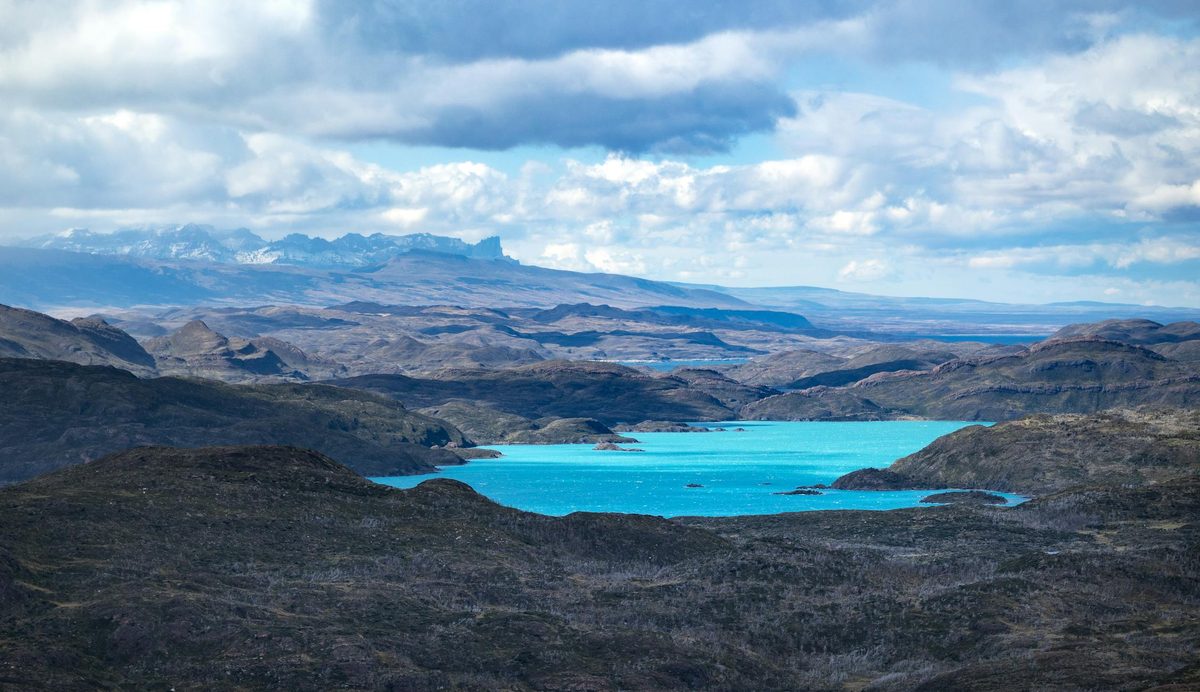 Turquoise lake surrounded by mountains in Torres del Paine National Park