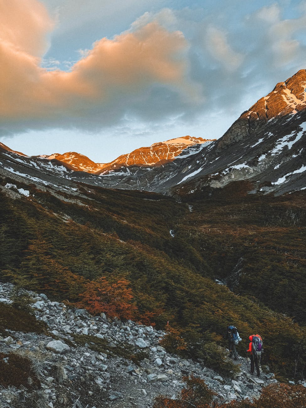 Sunset over rugged coastline in the Magallanes region of southern Chile with dramatic clouds