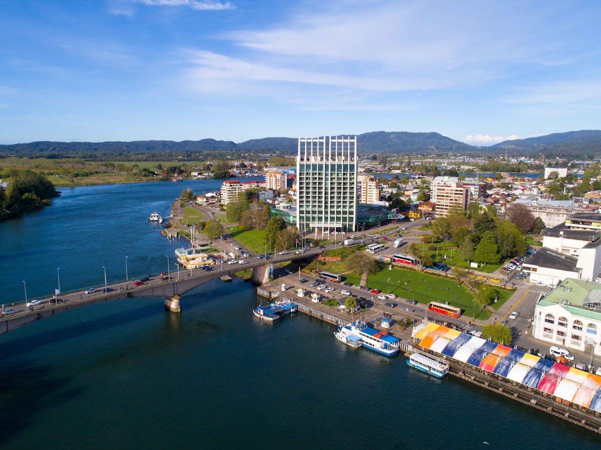 Aerial view of Valdivia Chile showing the river, bridge, and city buildings