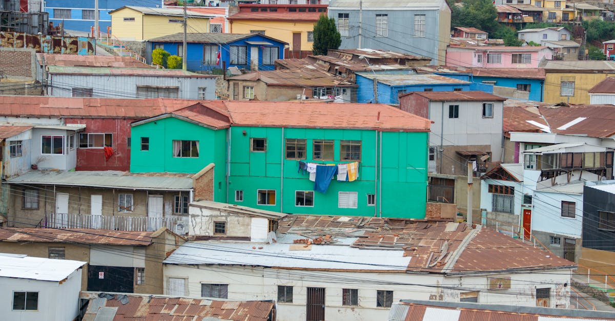 Narrow colorful street on Cerro Alegre in Valparaiso with painted buildings on both sides