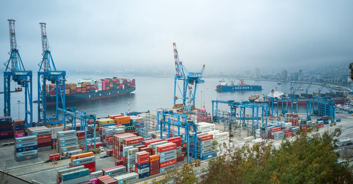 Valparaiso port with boats and colorful hillside buildings in the background