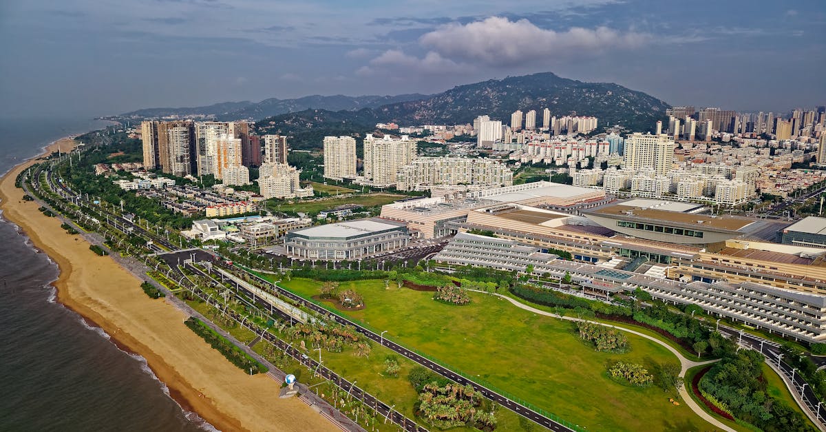 Coastal city view with modern buildings along a beach and blue ocean